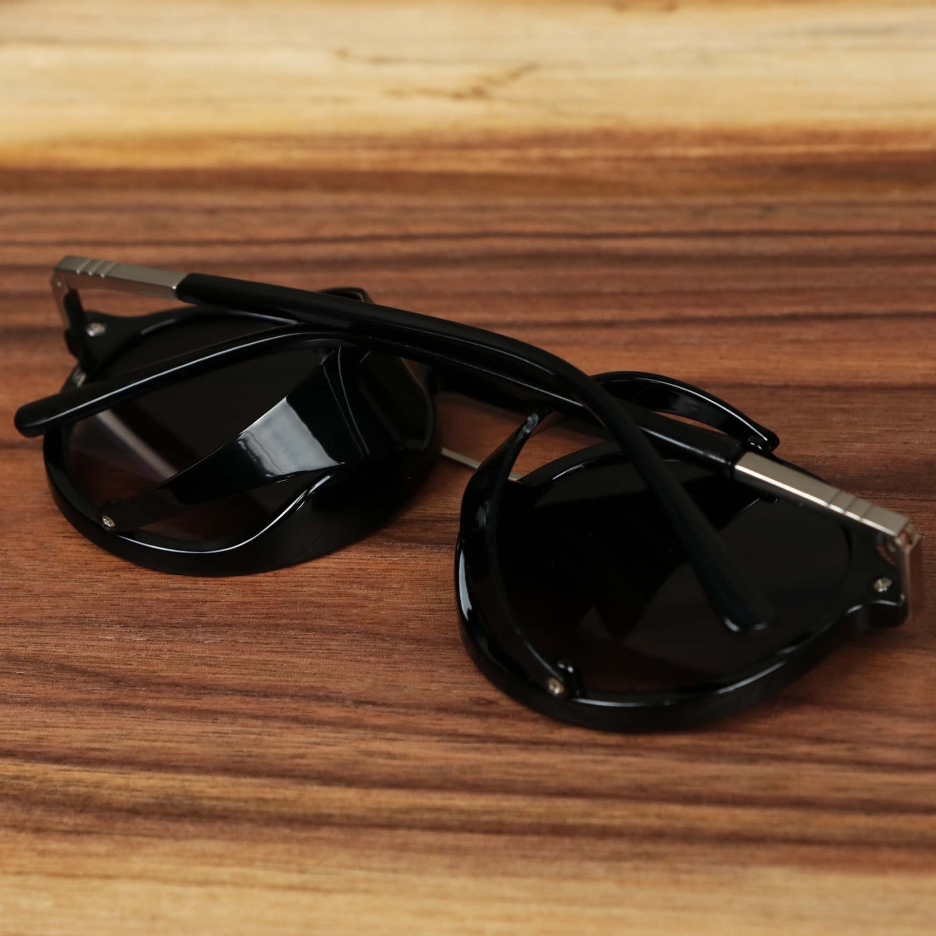 The Steampunk Frames Black Lens Sunglasses with Black Glossy Frame folded up