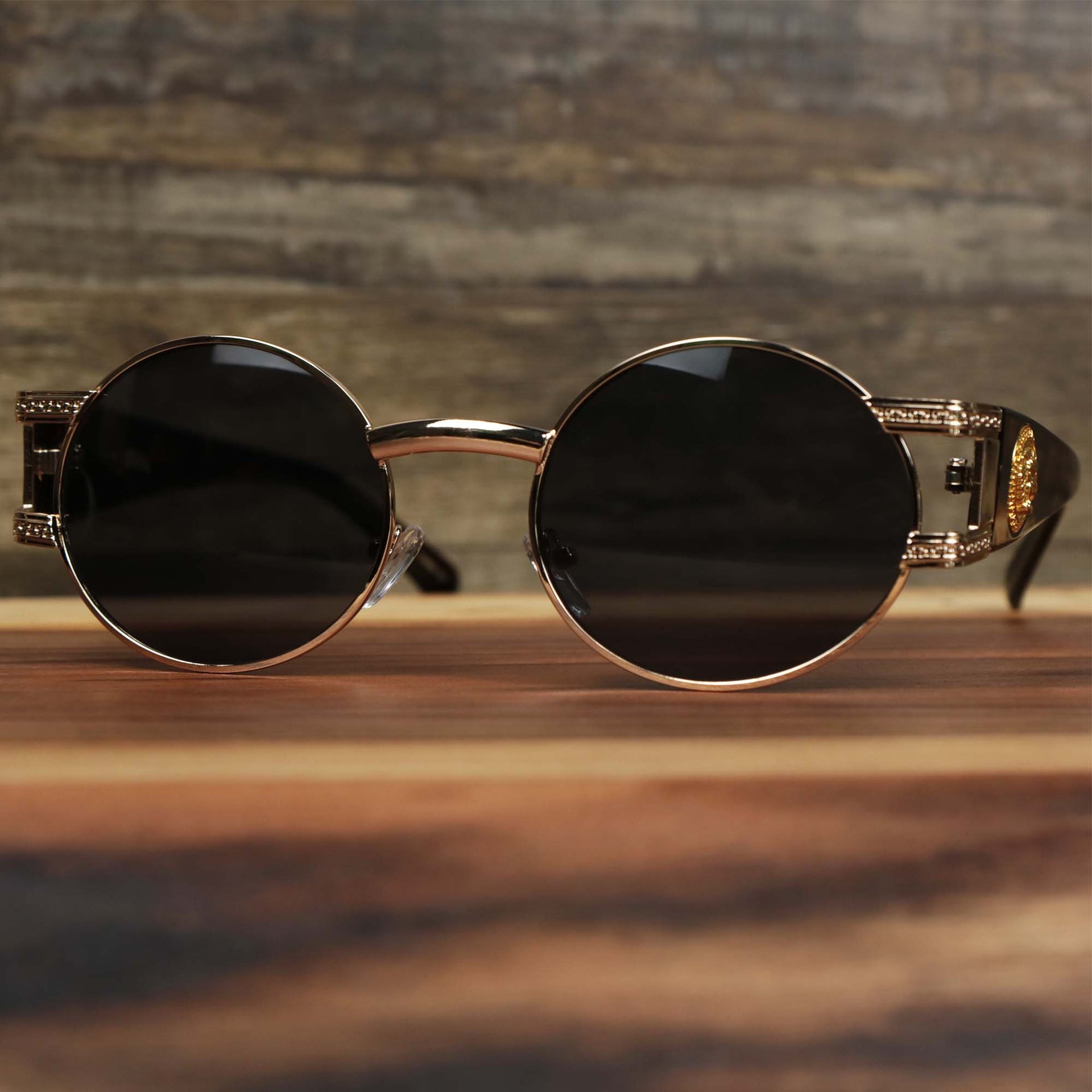 The Circle Frame Lion Head Emblem Black Lens Sunglasses with Rose Gold Frame