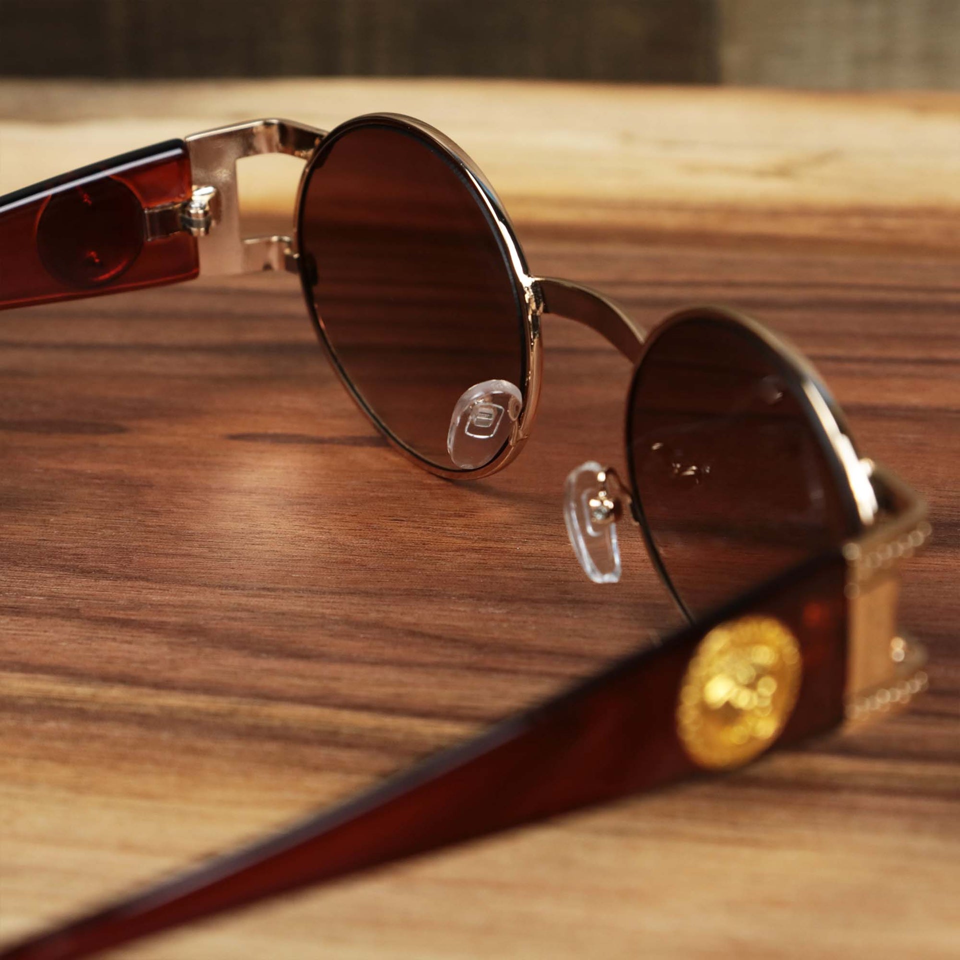 The inside of the Circle Frame Lion Head Emblem Brown Lens Sunglasses with Rose Gold Frame