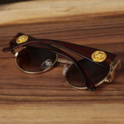 The Circle Frame Lion Head Emblem Brown Lens Sunglasses with Rose Gold Frame folded up