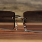 The bridge on the Rectangle Frame Black Lens Sunglasses with Gold Frame