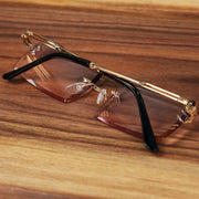 The Rectangle Frame Pink Blue Gradient Lens Sunglasses with Gold Frame folded up