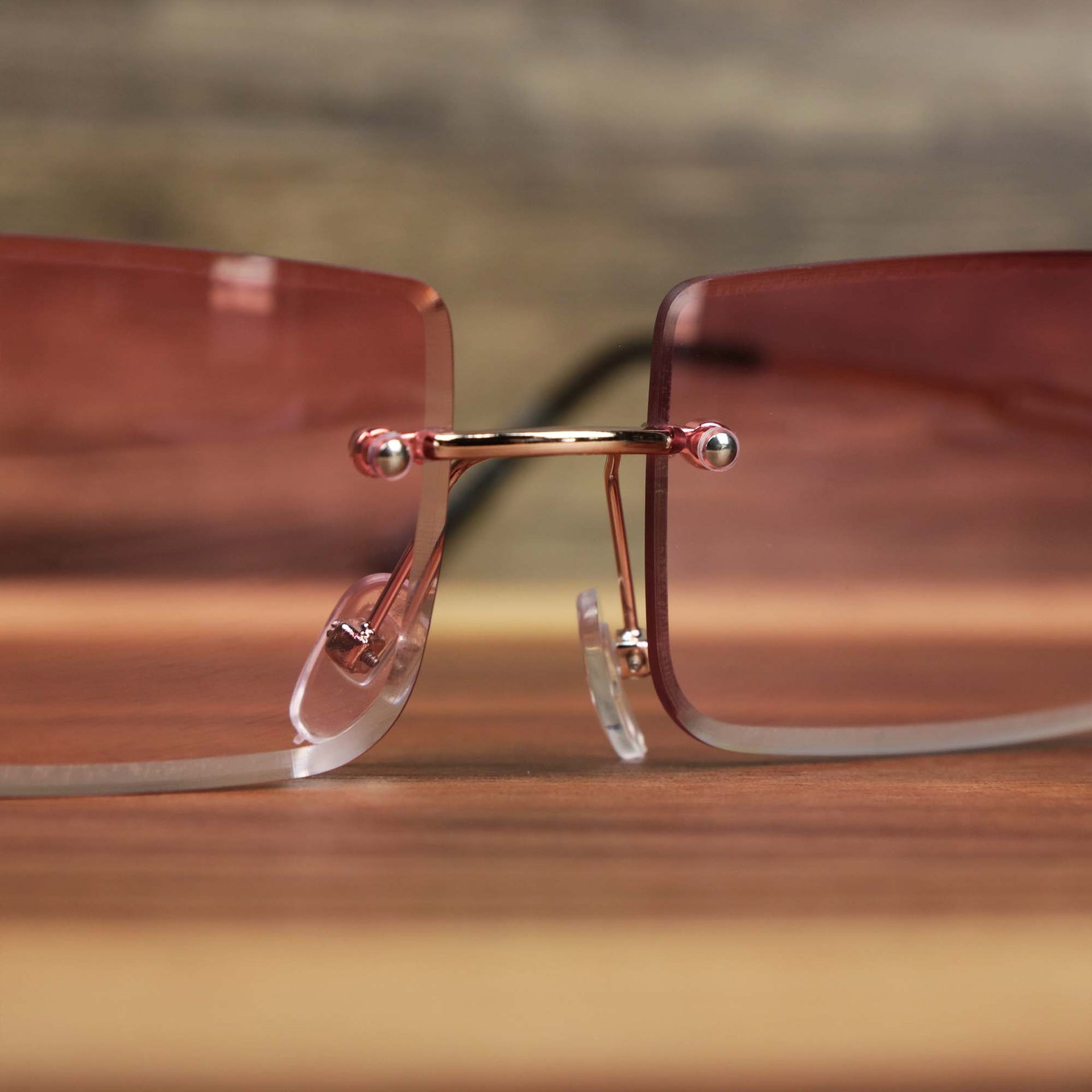 The bridge on the Rectangle Frame Pink Lens Sunglasses with Gold Frame