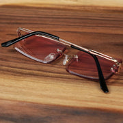 The Rectangle Frame Pink Lens Sunglasses with Gold Frame folded up