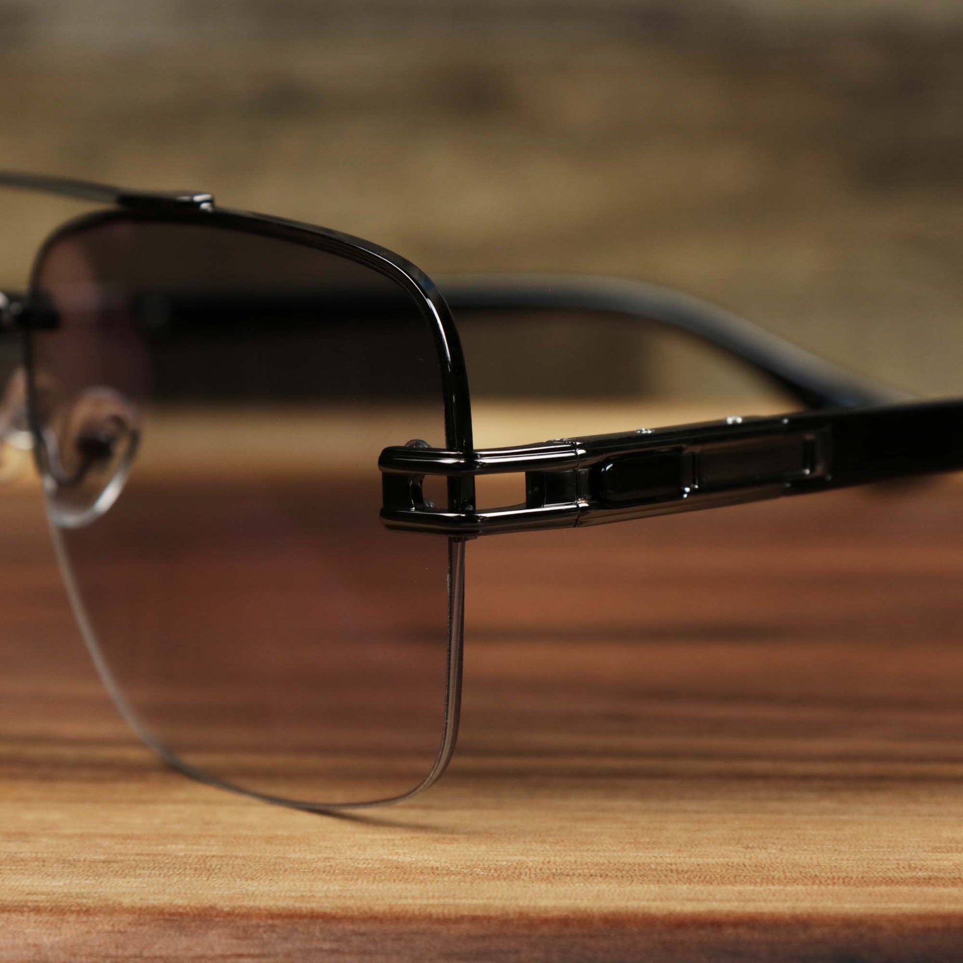 The hinge on the Round Rectangle Frame Black Lens Sunglasses with Black Frame