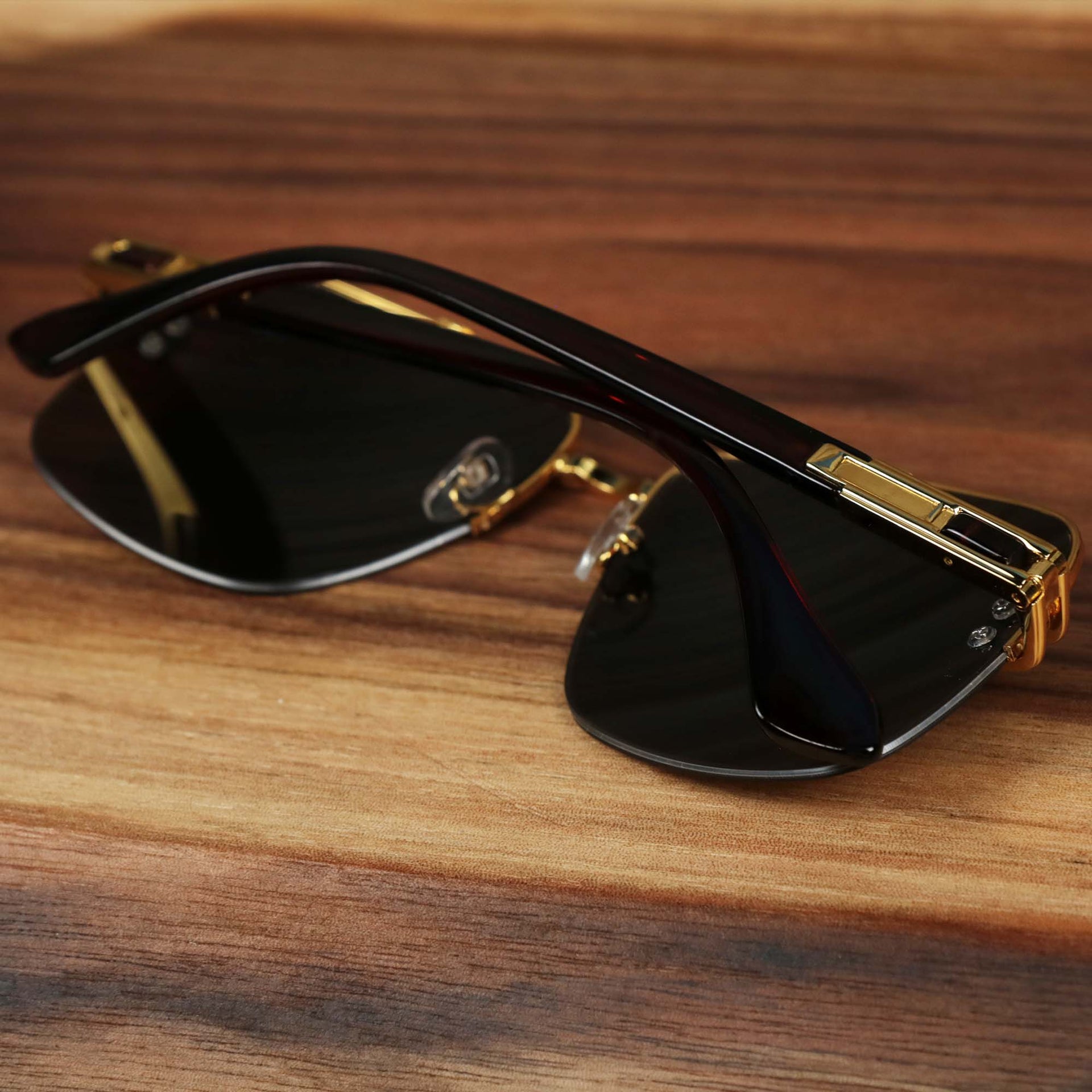 The Round Rectangle Frame Brown Lens Sunglasses with Gold Frame folded up