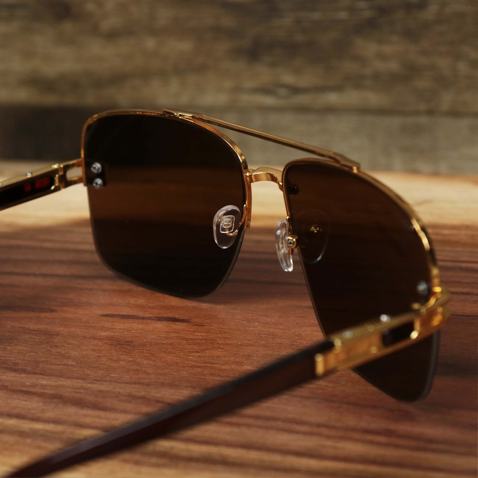The inside of the Round Rectangle Frame Black Lens Sunglasses with Gold Frame