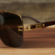 The hinge on the Round Rectangle Frame Black Lens Sunglasses with Gold Frame