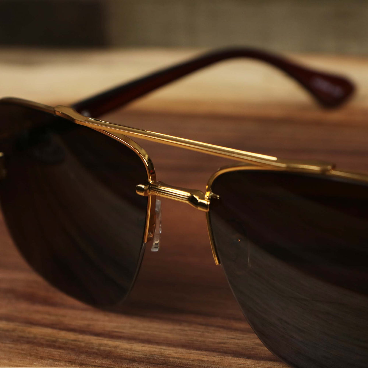 The bridge on the Round Rectangle Frame Black Lens Sunglasses with Gold Frame