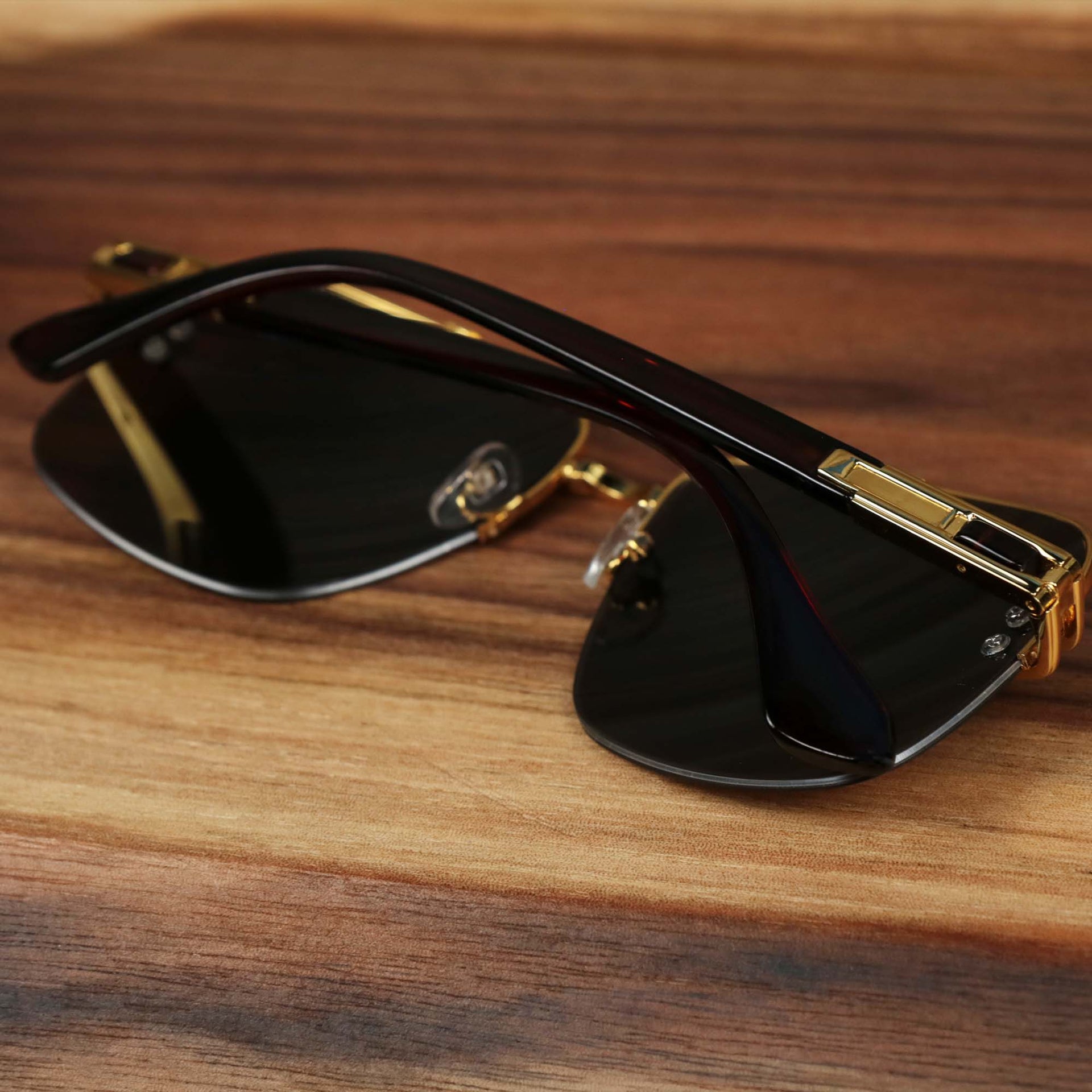 The Round Rectangle Frame Black Lens Sunglasses with Gold Frame folded up