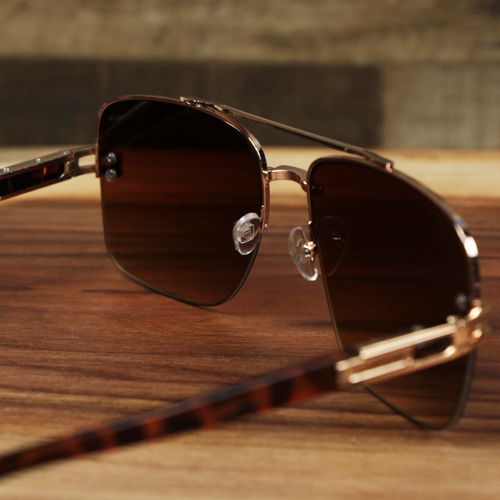 The inside of the Round Rectangle Frame Brown Lens Sunglasses with Rose Gold Tortoise Frame