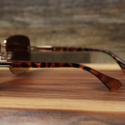 The arms on the Round Rectangle Frame Brown Lens Sunglasses with Rose Gold Tortoise Frame