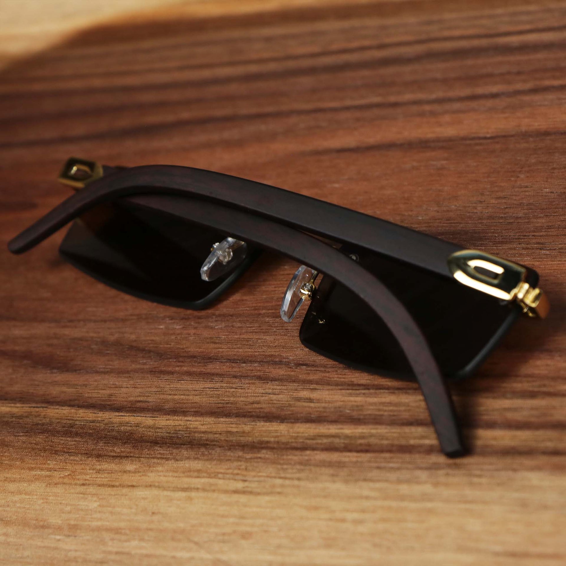 The Rectangle Wood and Metal Frame Brown Lens Sunglasses with Gold Frame folded open