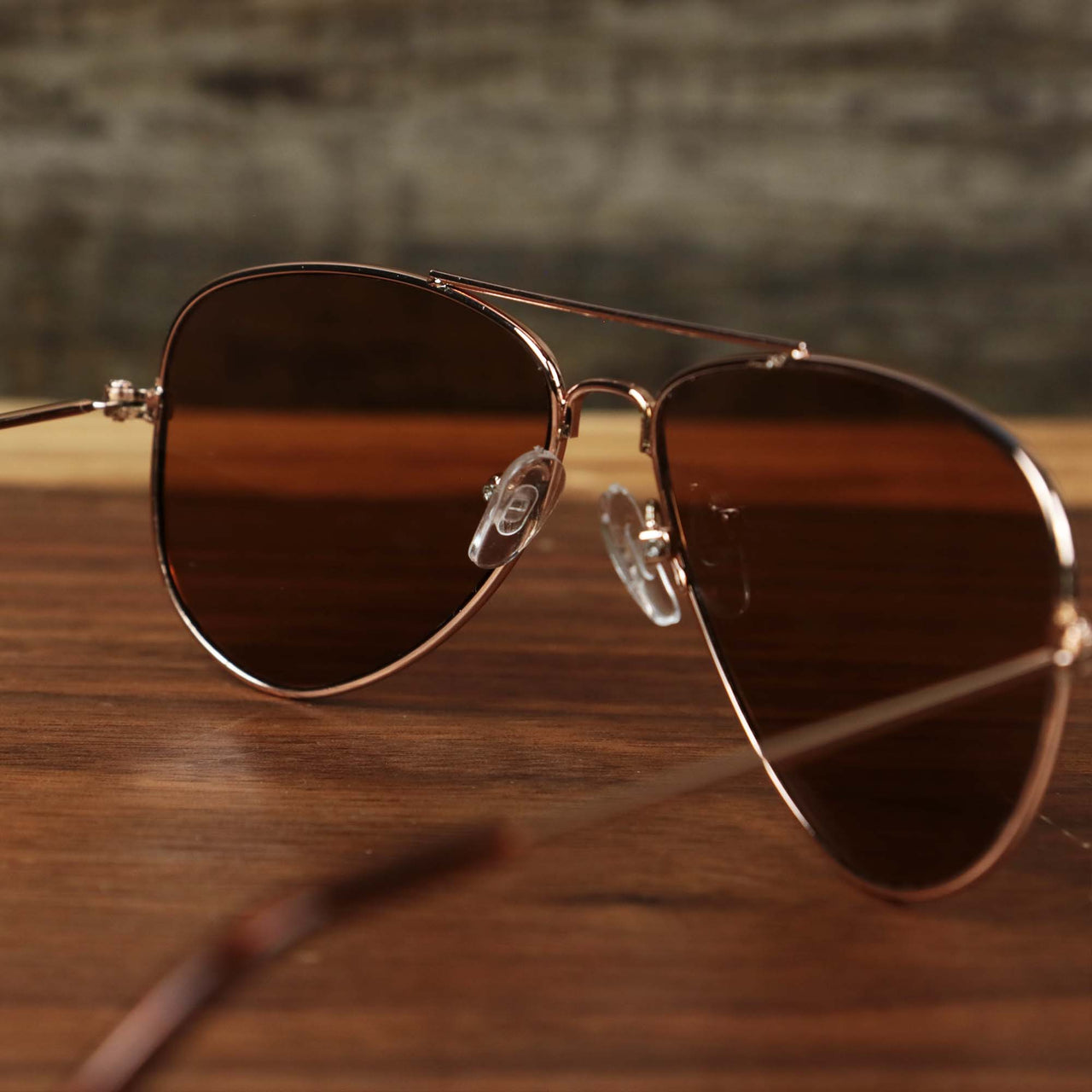 The inside of the Kid’s Aviator Frame Brown Lens Sunglasses with Rose Gold Frame