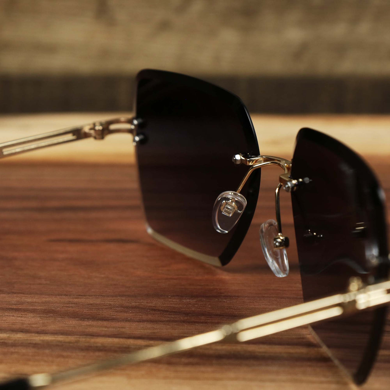 The inside of the Large Lightweight Frame Brown Lens Sunglasses with Gold Frame