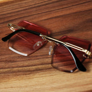 The Large Lightweight Frame Pink Lens Sunglasses with Rose Gold Frame folded up