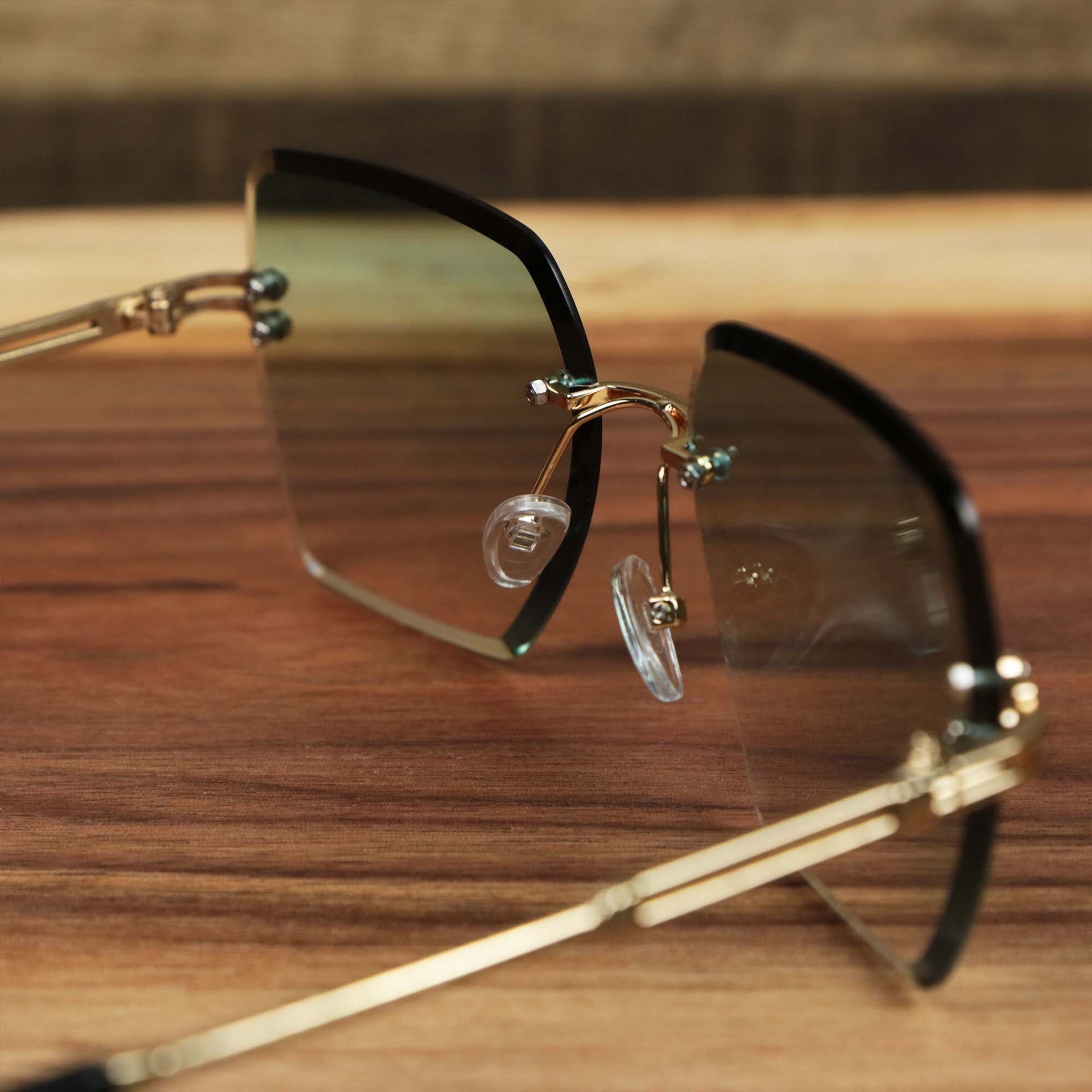 The inside of the Large Lightweight Frame Green Lens Sunglasses with Gold Frame