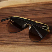 The Round Aviator Frames Brown Gradient Lens Sunglasses with Gold Frame foldded up
