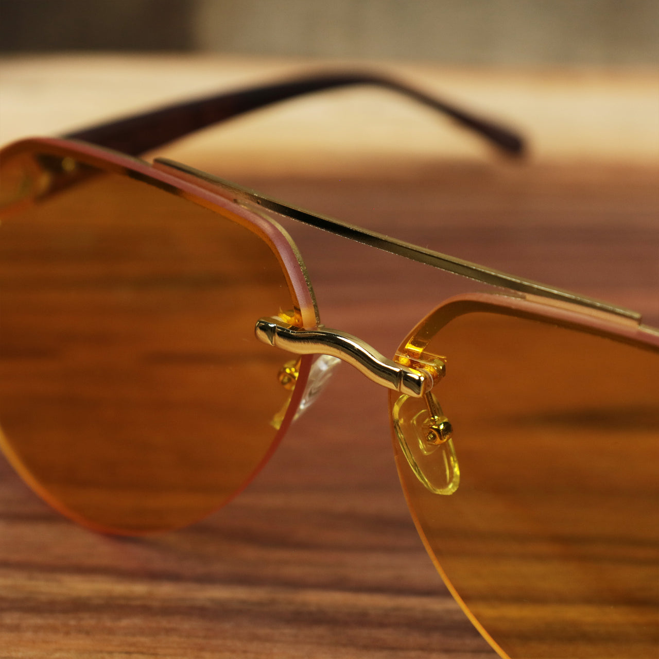 The bridge on the Round Aviator Frames Yellow Lens Sunglasses with Gold Frame