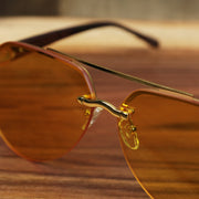 The bridge on the Round Aviator Frames Yellow Lens Sunglasses with Gold Frame