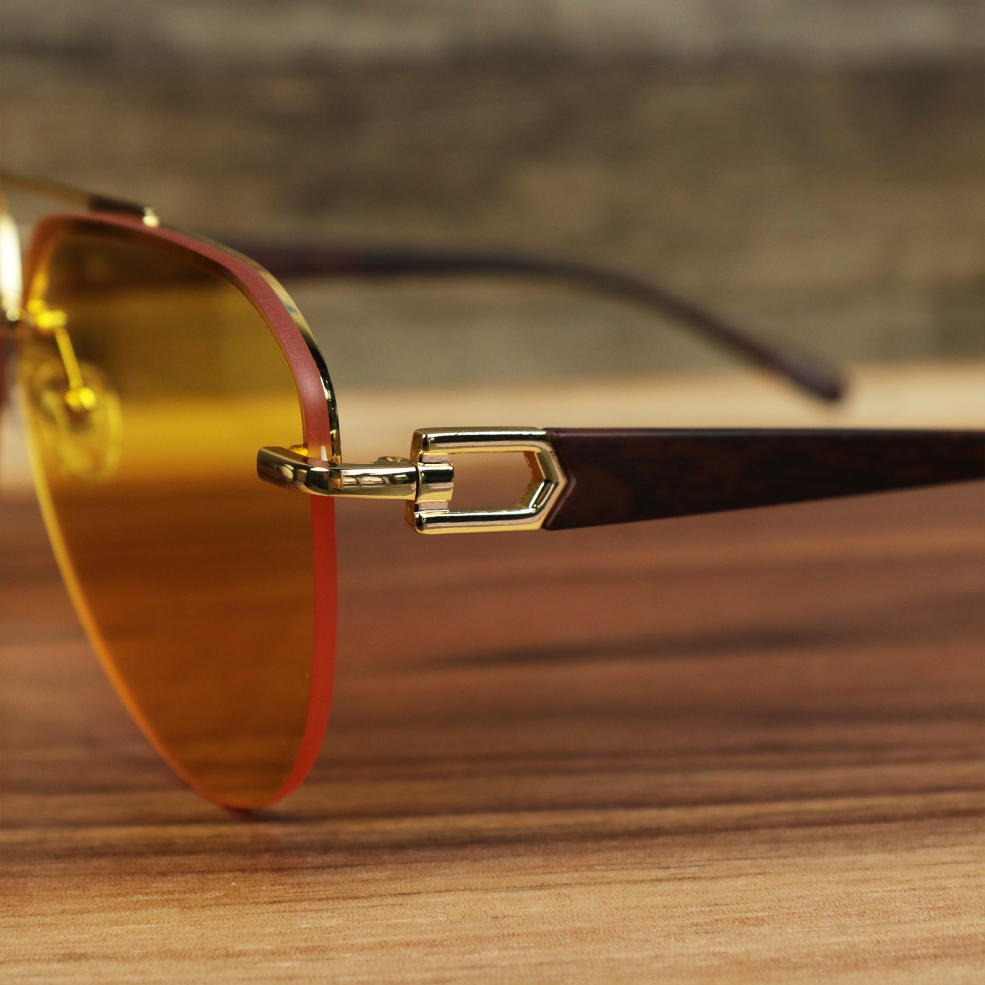 The hinge on the Round Aviator Frames Yellow Lens Sunglasses with Gold Frame