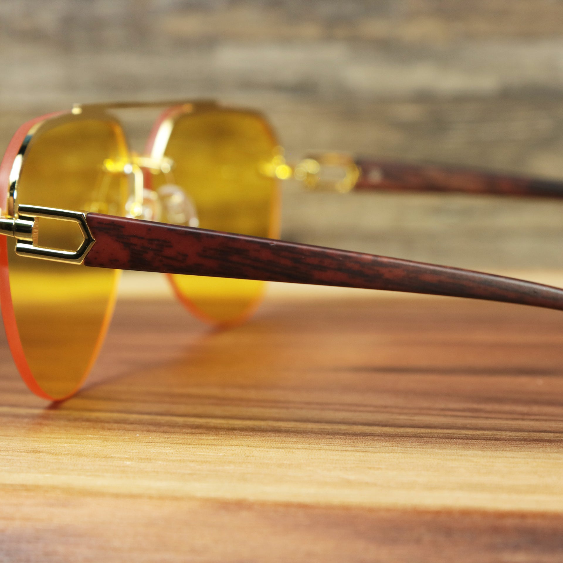 The arms of the Round Aviator Frames Yellow Lens Sunglasses with Gold Frame
