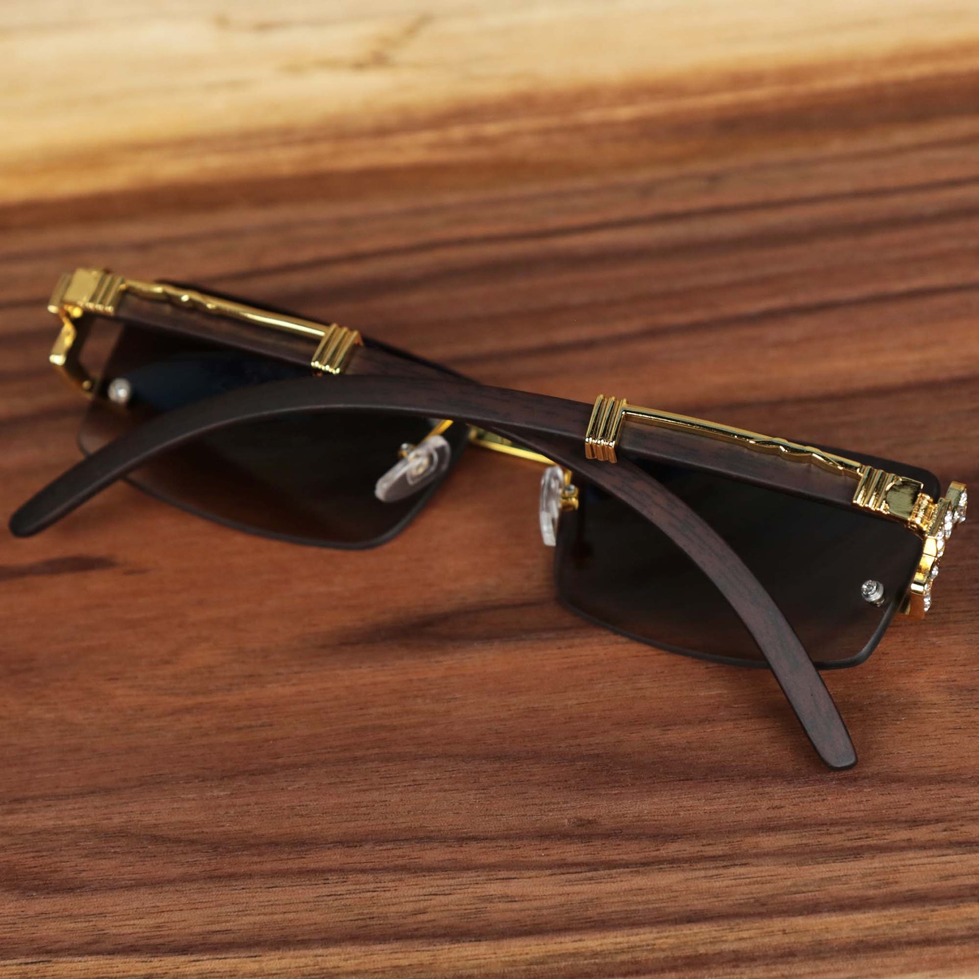 The Rectangle Frames Black Lens Flooded Sunglasses with Gold Frame folded up