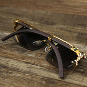 The Rectangle Frames Black Gradient Lens Flooded Sunglasses with Gold Frame folded up