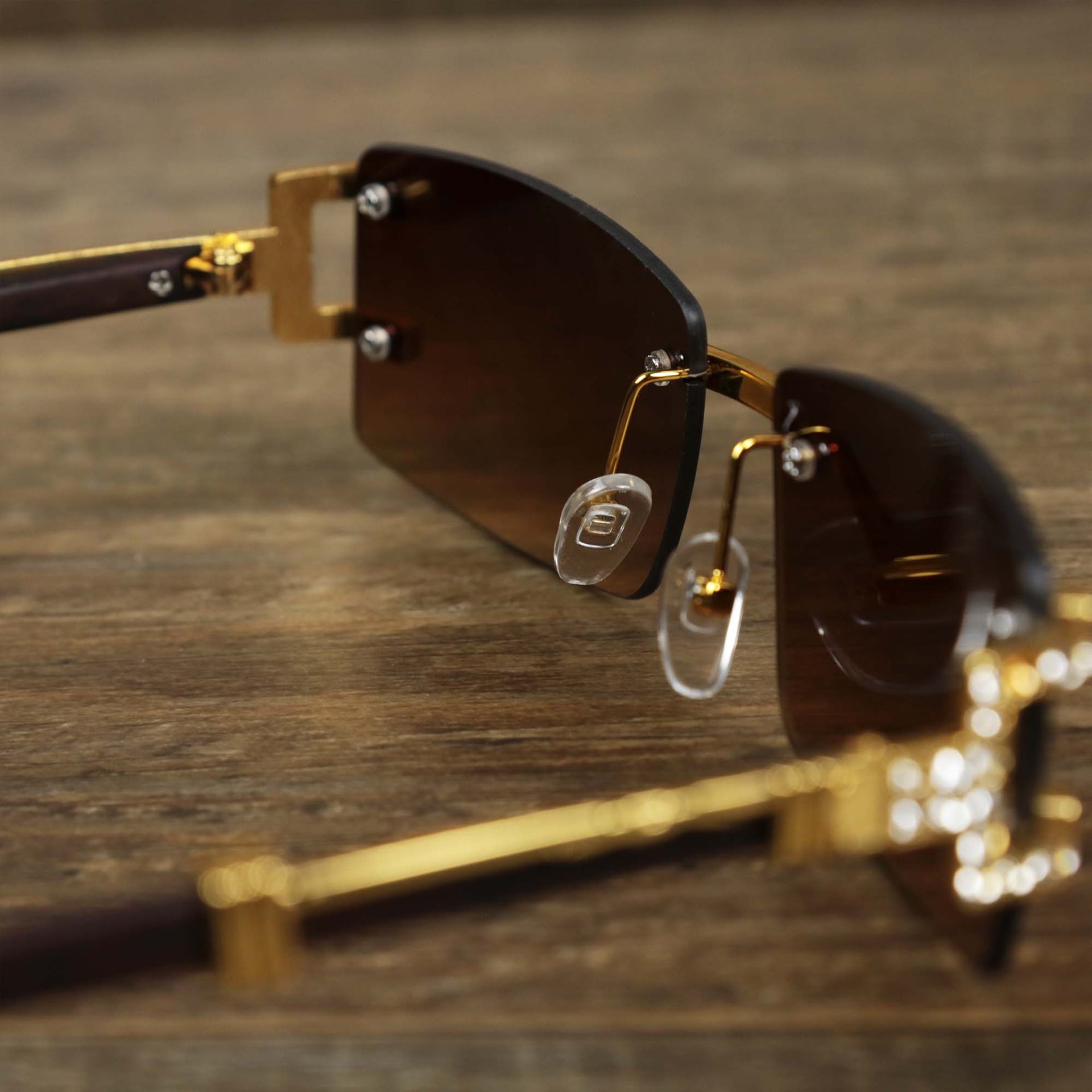 The inside of the Rectangle Frames Brown Gradient Lens Flooded Sunglasses with Gold Frame
