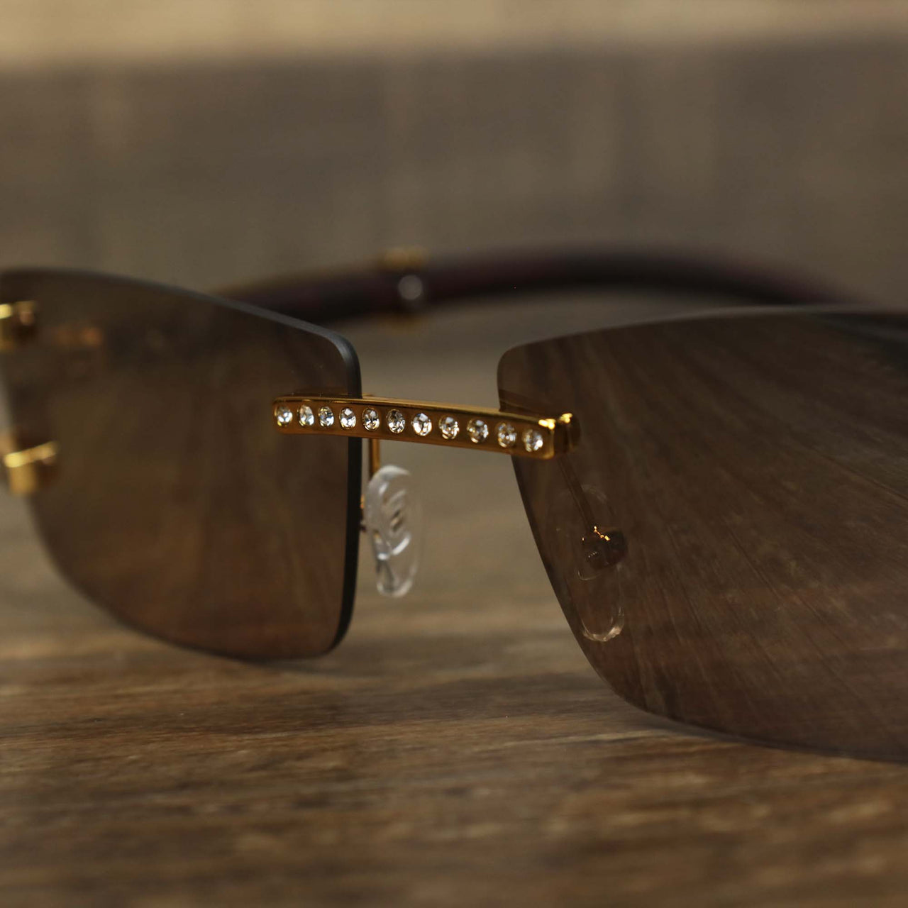 The bridge on the Rectangle Frames Brown Lens Flooded Sunglasses with Gold Frame