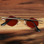 The Round Frames Red Lens Sunglasses with Gold Frame folded up
