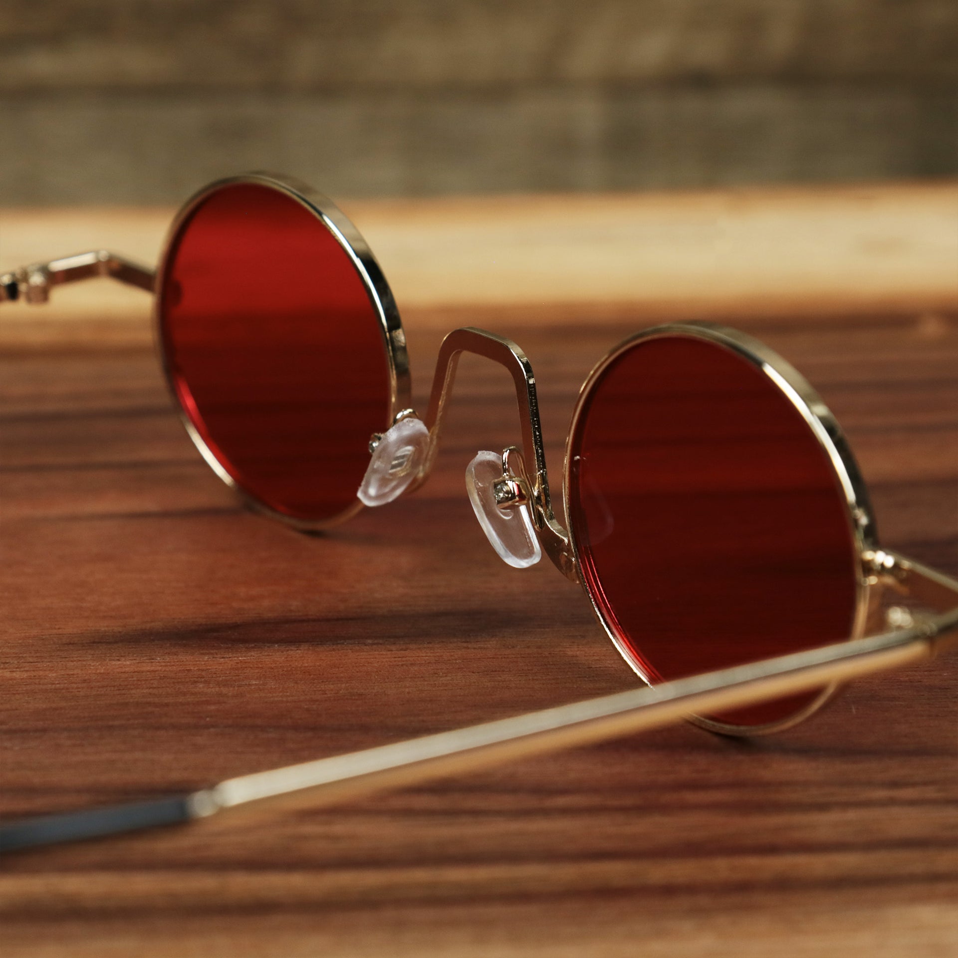 The inside of the Round Frames Red Lens Sunglasses with Gold Frame
