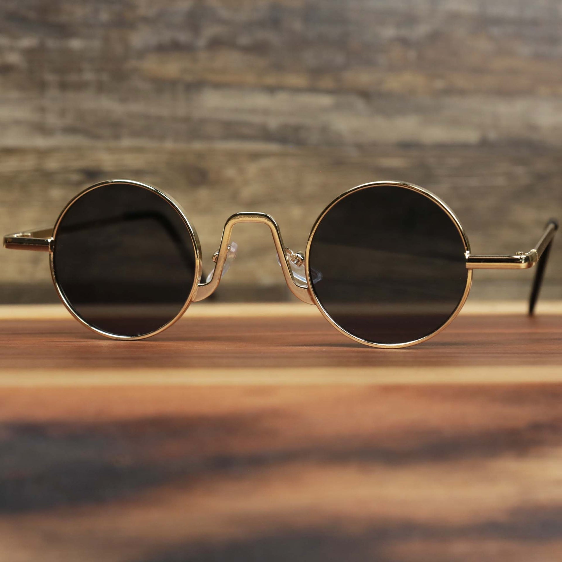 The Round Frames Black Lens Sunglasses with Gold Frame