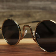 The bridge on the Round Frames Black Lens Sunglasses with Gold Frame