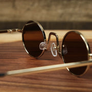The inside of the Round Frames Brown Lens Sunglasses with Gold Frame
