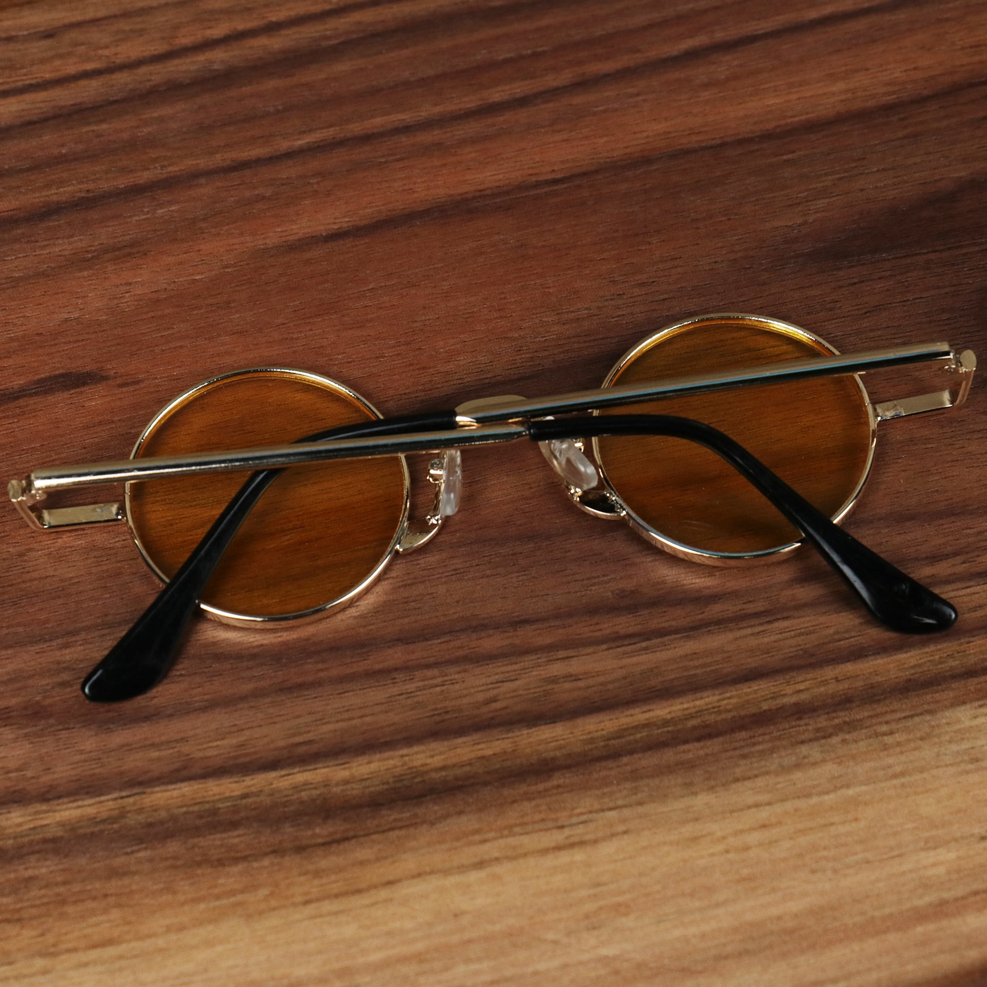The Round Frames Yellow Lens Sunglasses with Gold Frame folded up