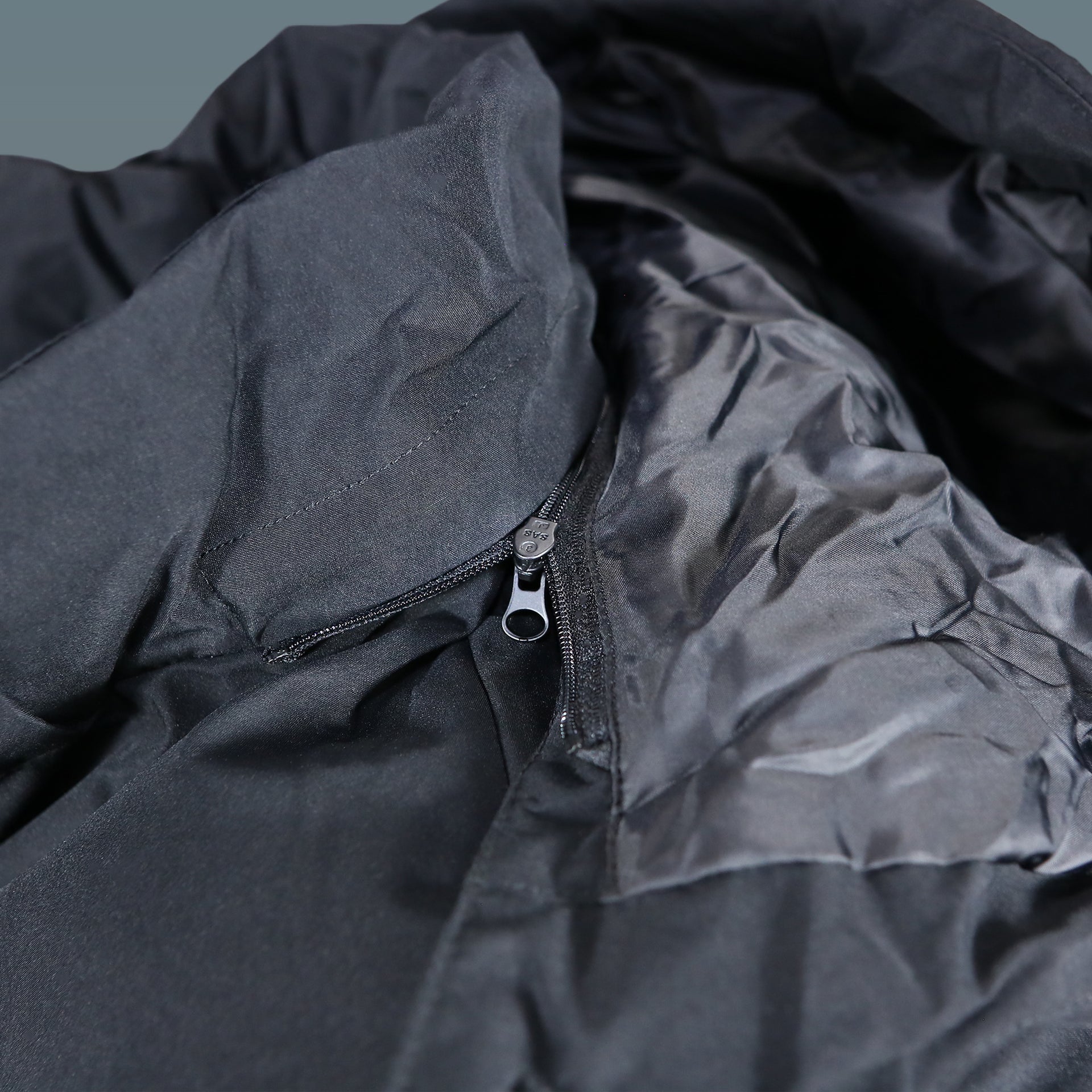 The zipper on the Jack And Jones Jet Black Puffer Jacket With Hidden Pocket | Black Puffer Jacket