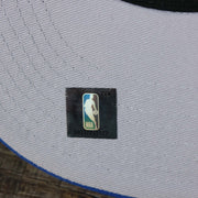 The NBA Jerry West Sticker on the New York Knicks NBA 2022 Draft Gray Bottom 9Fifty Snapback | New Era Cream/Royal Blue