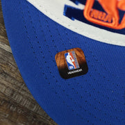 The NBA Offical Headwear Sticker on the New York Knicks NBA 2022 Draft Gray Bottom 9Fifty Snapback | New Era Cream/Royal Blue