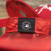The MLB Merchandise Tag on the Anaheim Angels Metallic All Star Game MLB 2022 Side Patch 9Fifty Mesh Snapback | ASG 2022 Red Trucker Hat