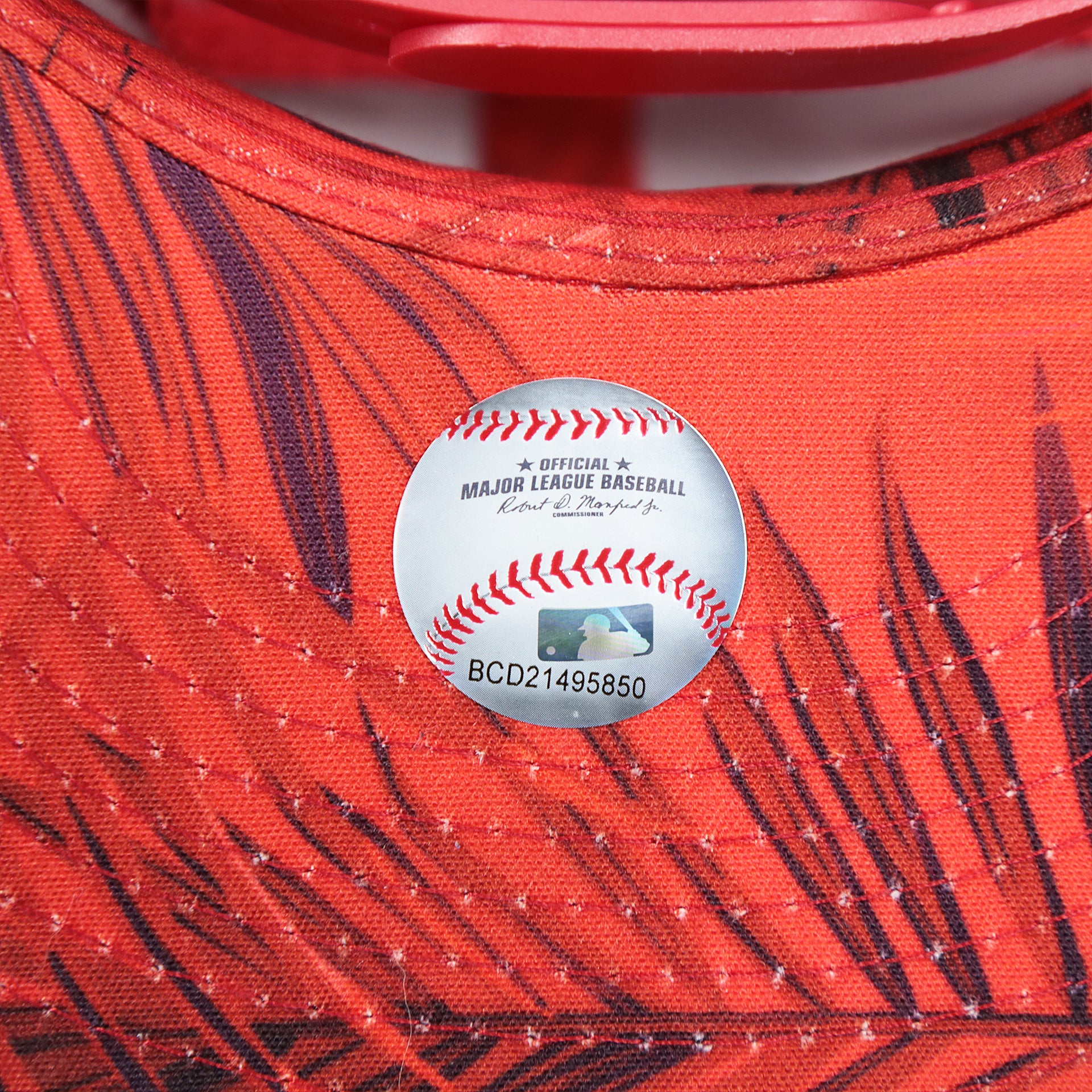 The MLB Sticker on the Anaheim Angels Metallic All Star Game MLB 2022 Side Patch 9Fifty Mesh Snapback | ASG 2022 Red Trucker Hat