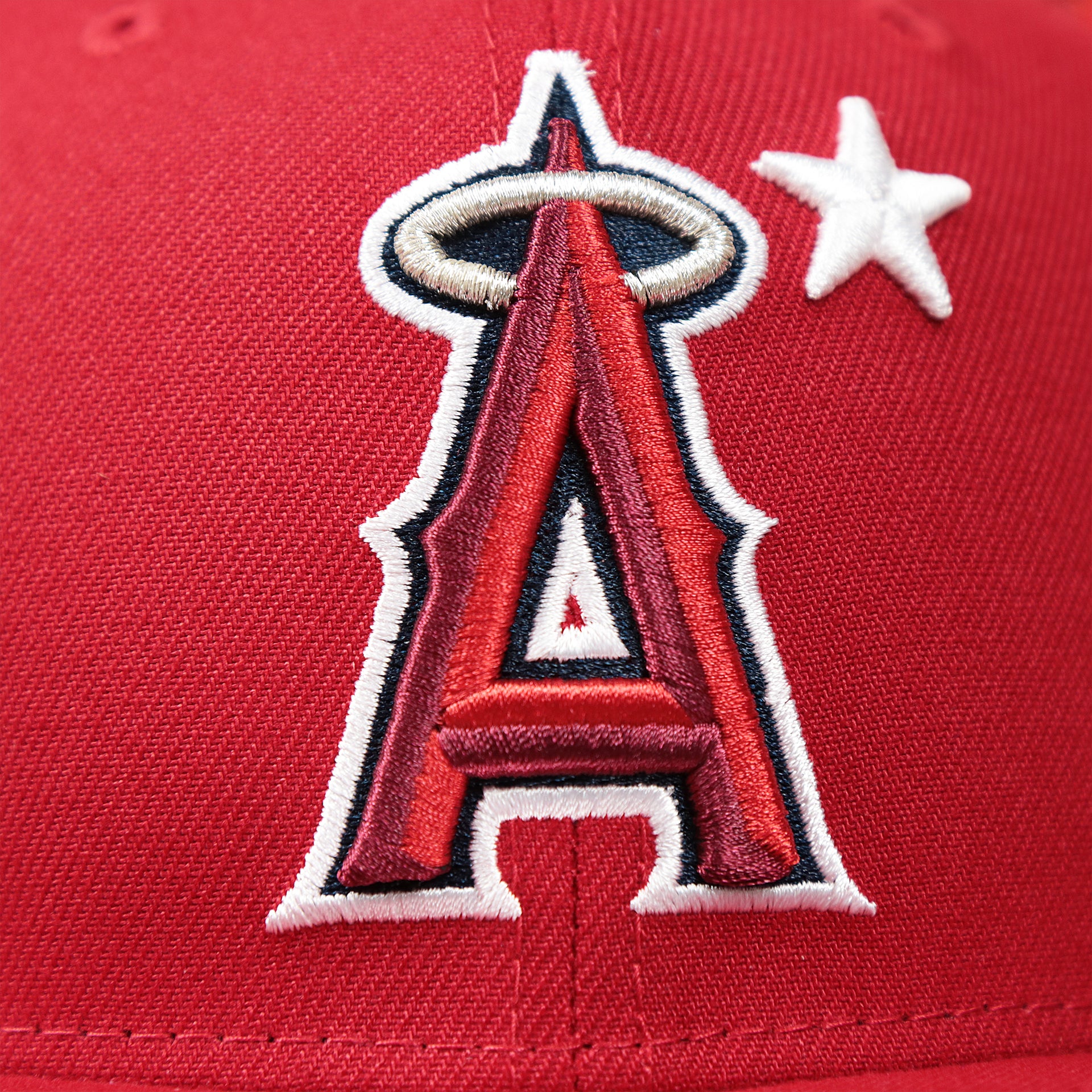 The Angels Logo on the Youth Anaheim Angels MLB 2022 All Star Game Mesh Back 9Fifty Snapback Cap | ASG 2022 Red Trucker Hat