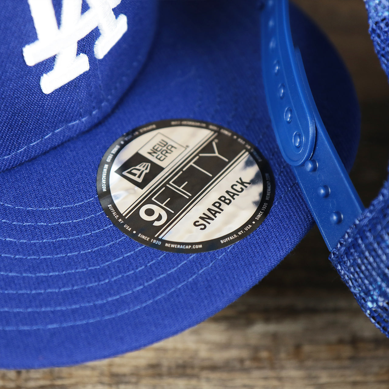 The 9Fifty Sticker on the Los Angeles Dodgers Metallic All Star Game MLB 2022 Side Patch 9Fifty Mesh Snapback | ASG 2022 Royal Blue Trucker Hat