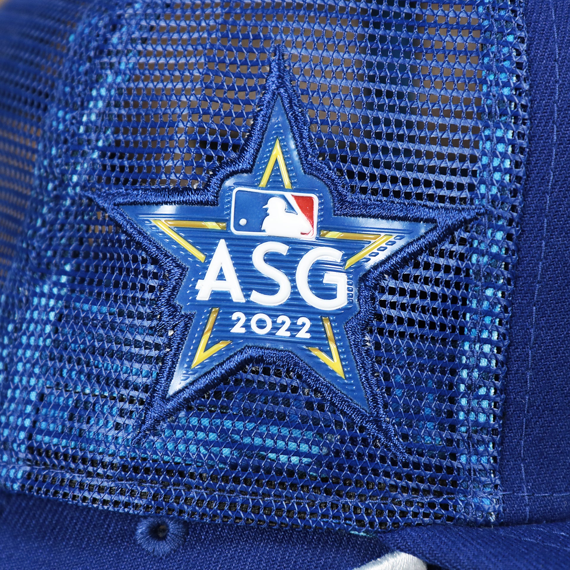 The ASG 2022 Patch on the Los Angeles Dodgers Metallic All Star Game MLB 2022 Side Patch 9Fifty Mesh Snapback | ASG 2022 Royal Blue Trucker Hat