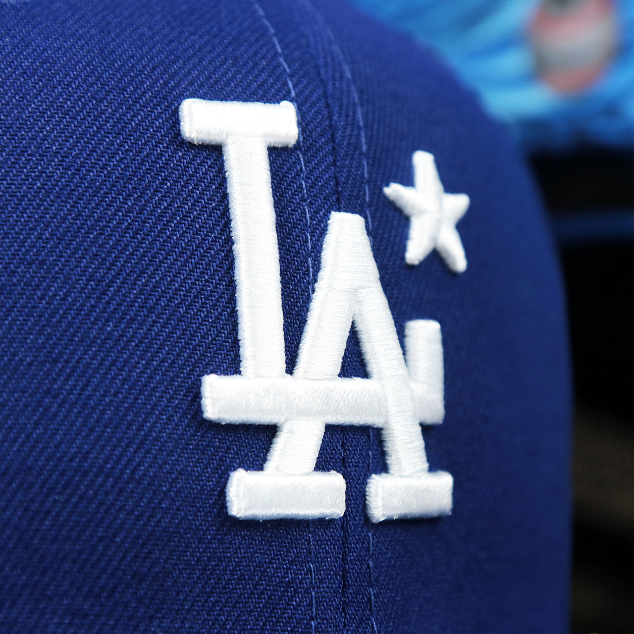 The Dodgers Logo on the Youth Los Angeles Dodgers MLB 2022 All Star Game Mesh Back 9Fifty Snapback Cap | ASG 2022 Royal Blue Trucker Hat