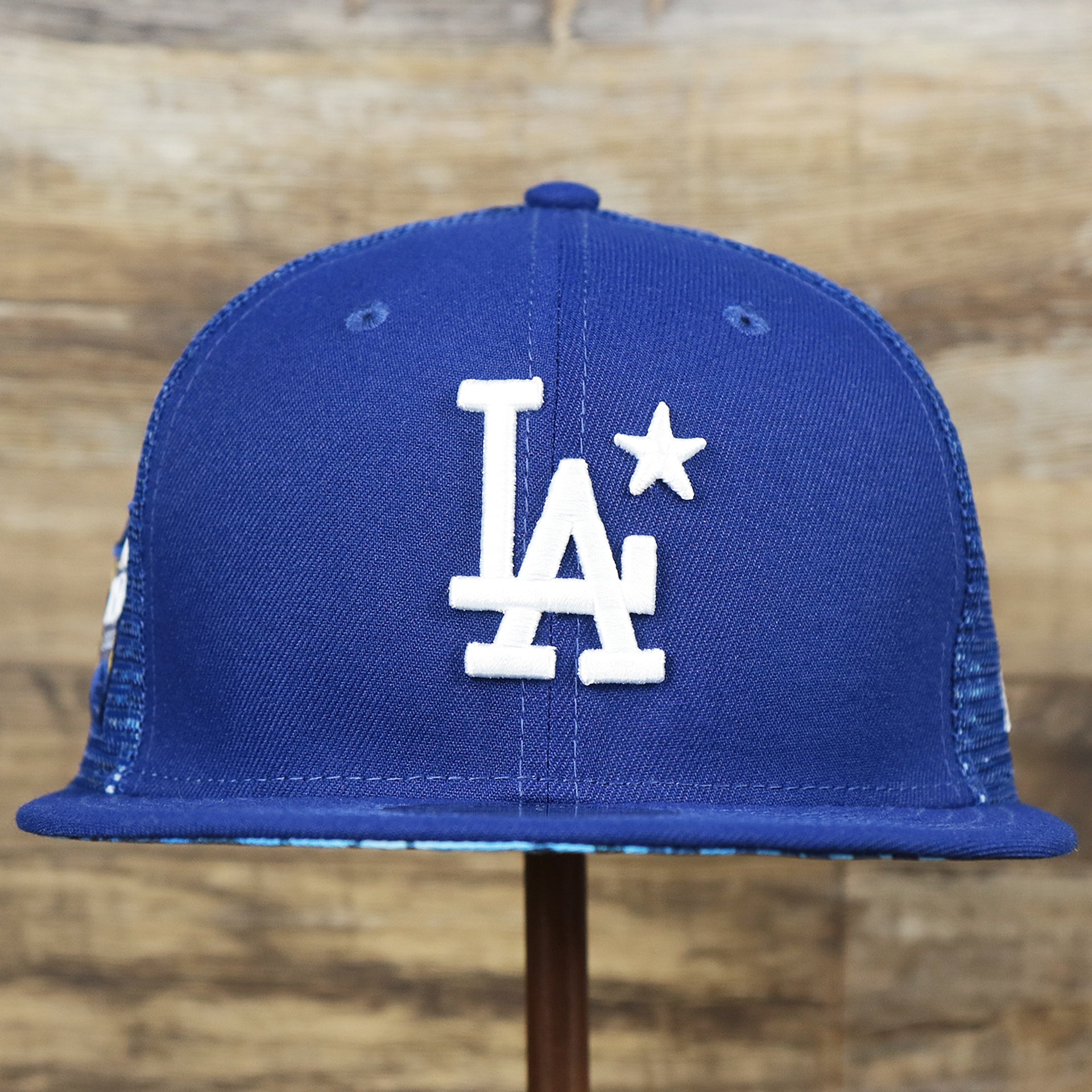 The front of the Youth Los Angeles Dodgers MLB 2022 All Star Game Mesh Back 9Fifty Snapback Cap | ASG 2022 Royal Blue Trucker Hat