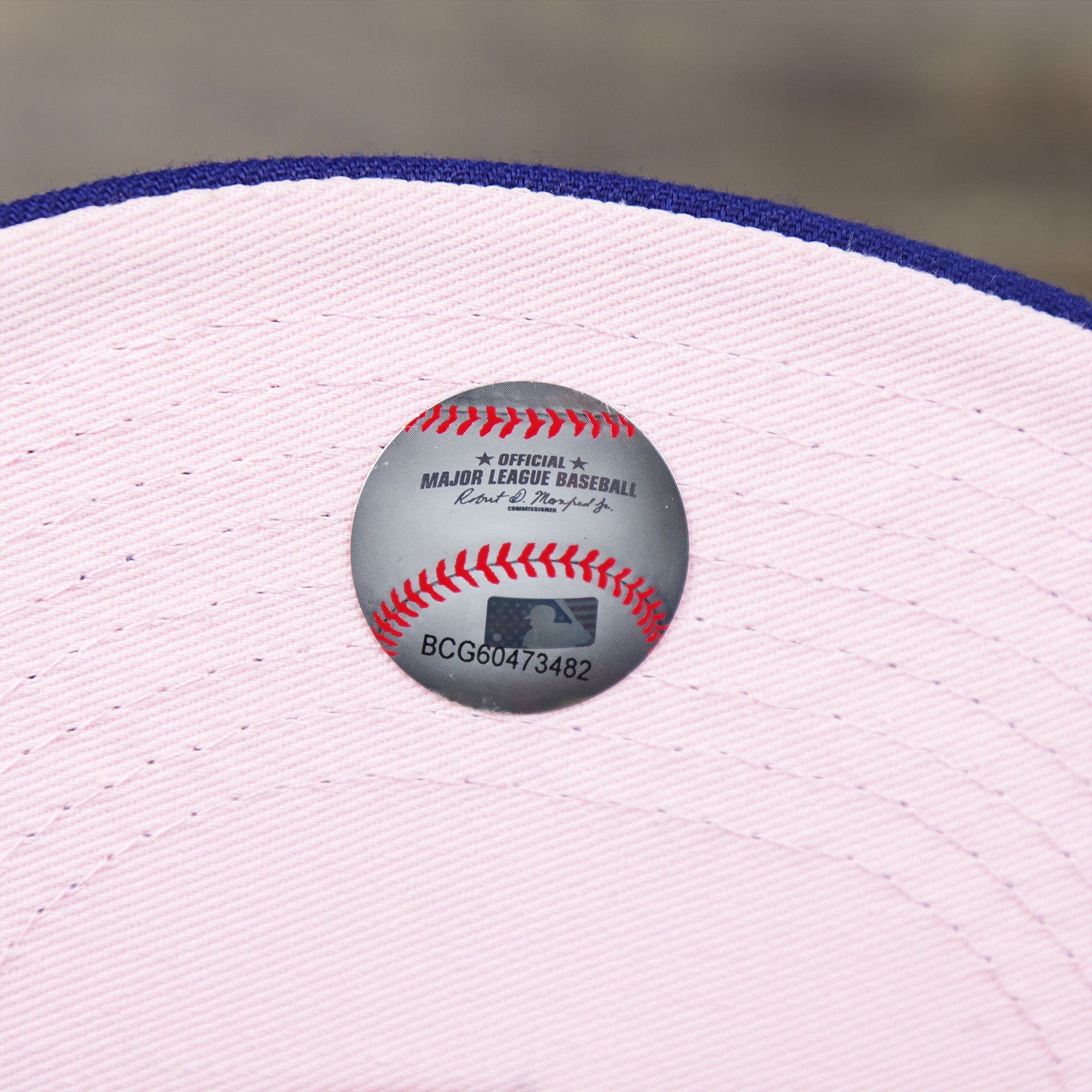 The MLB Baseball Sticker on the Los Angeles Dodgers Pop Sweat Pastel World Series Side Patch Fitted Cap With Pink Undervisor | Royal Blue 59Fifty Cap
