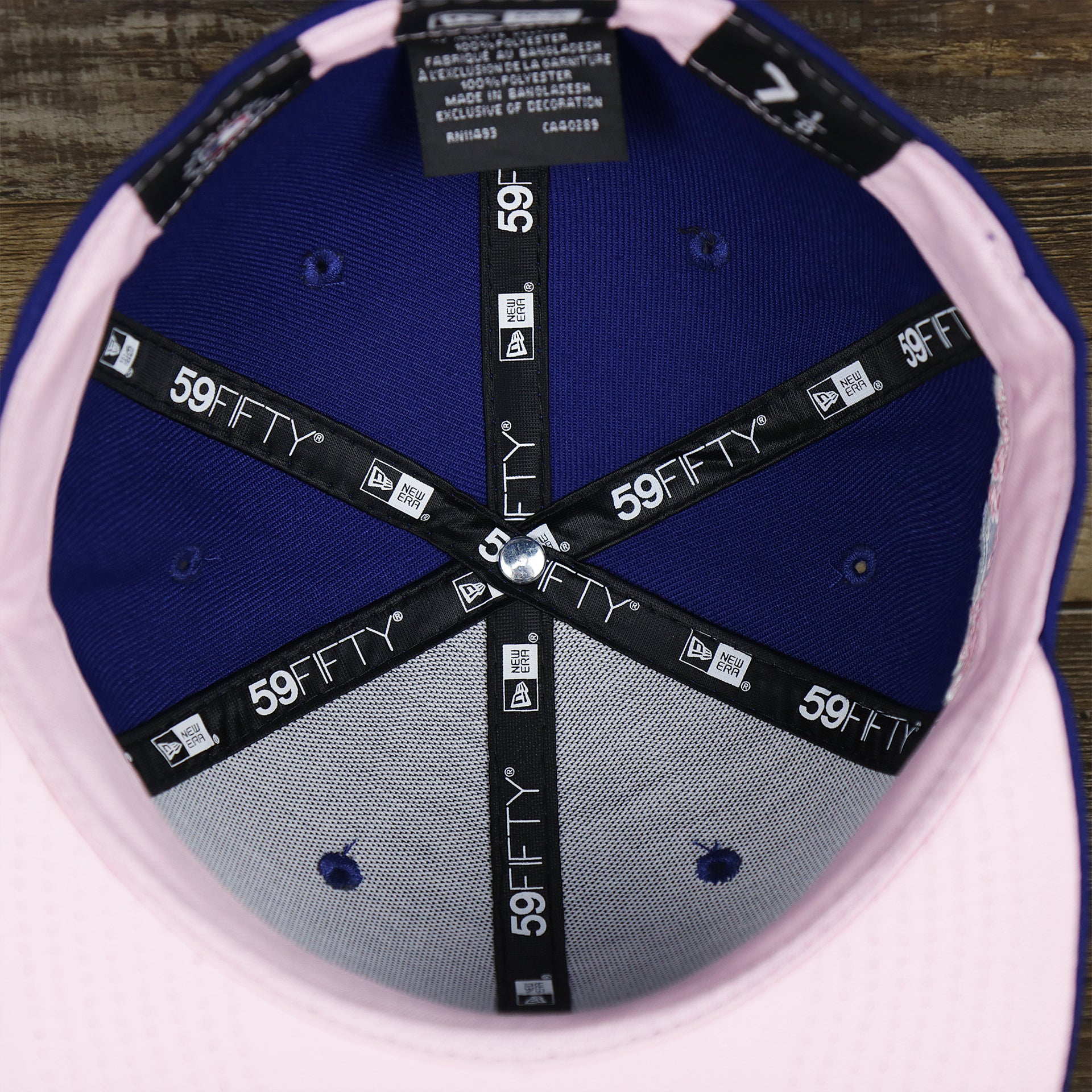 The inside of the Los Angeles Dodgers Pop Sweat Pastel World Series Side Patch Fitted Cap With Pink Undervisor | Royal Blue 59Fifty Cap