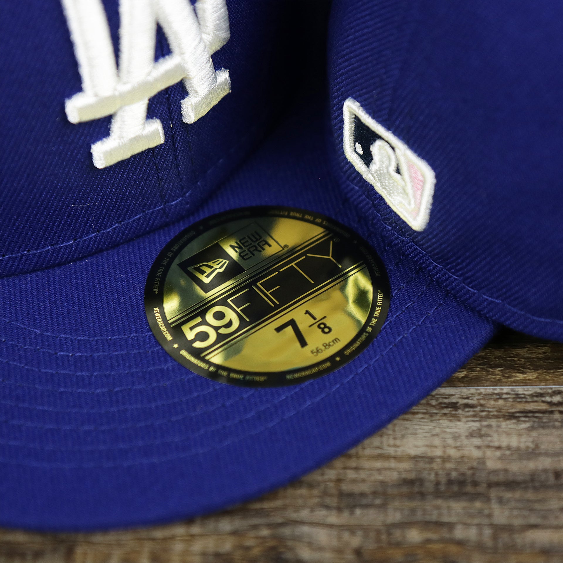 The 59Fifty Sticker on the Los Angeles Dodgers Pop Sweat Pastel World Series Side Patch Fitted Cap With Pink Undervisor | Royal Blue 59Fifty Cap