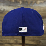 The backside of the Los Angeles Dodgers Pop Sweat Pastel World Series Side Patch Fitted Cap With Pink Undervisor | Royal Blue 59Fifty Cap
